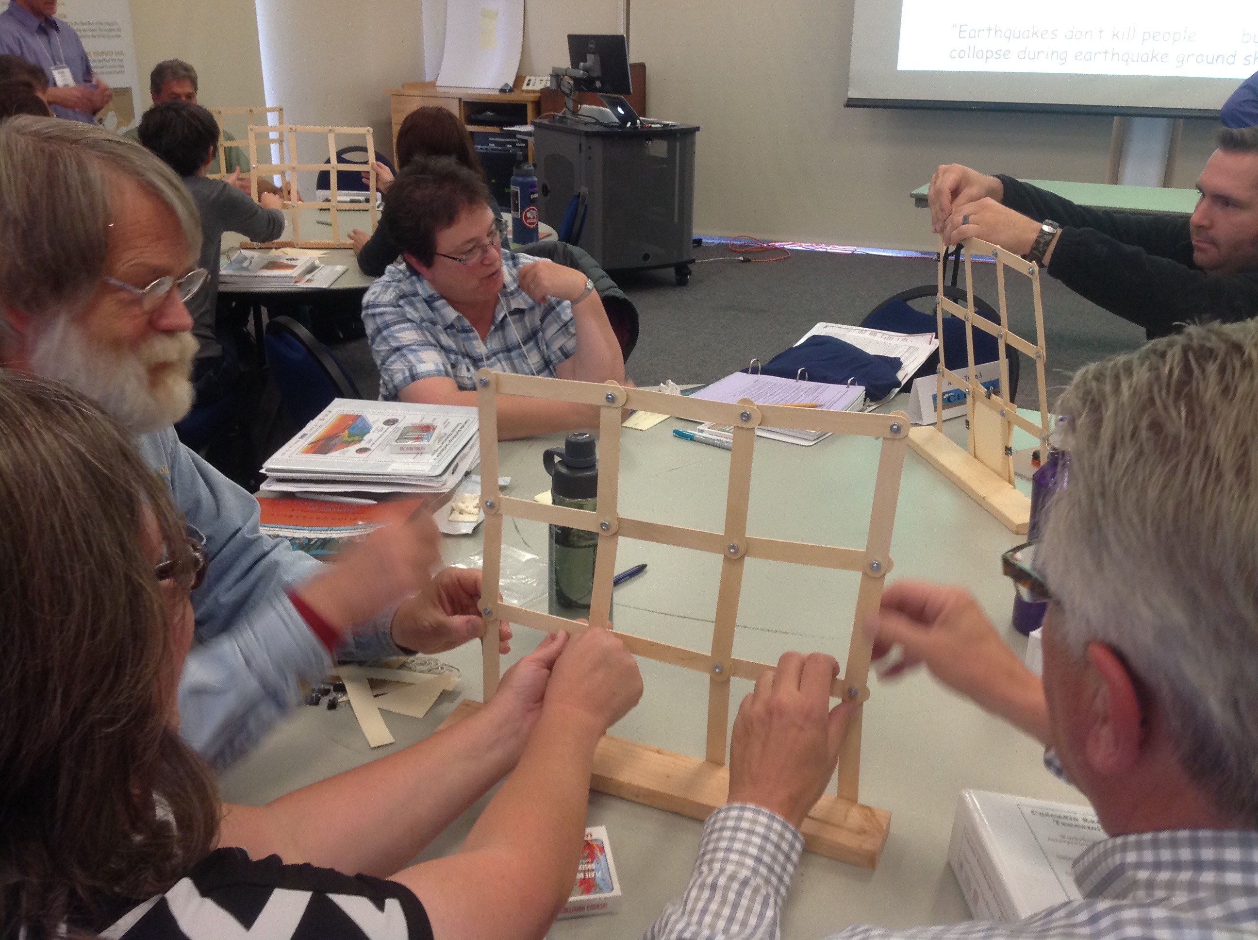 Workshop participants work with the "Build a Better Wall" activity, which allows learners to investigate earthquake-resilient engineering practices.